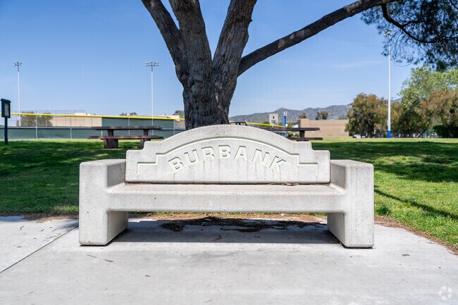 This charming park bench proudly displays the name 