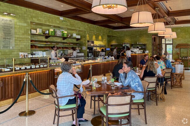 Residents of El Cid neighborhood enjoying a coffee and pastries at HIVE Bacery.