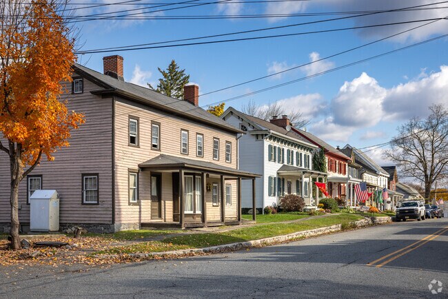 Autumnal colors cover of a row of 100+ year-old homes in downtown Hope Township, NJ.