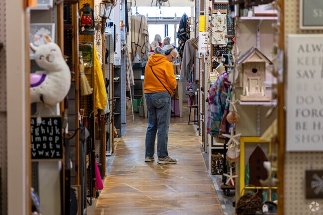 Weekend shoppers stroll through vendor stalls at The Shoppes at Homespun near Concord.