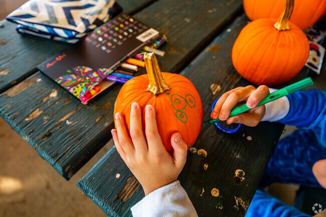 Pumpkin decoration is a favorite activitiy in the Halloween Festival at Eisnehower Park.