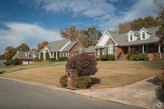 Blue Spring features large brick homes with landscaped yards.