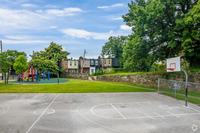 Warwick Avenue Park offers a playground, basketball court, and plenty of open green space.