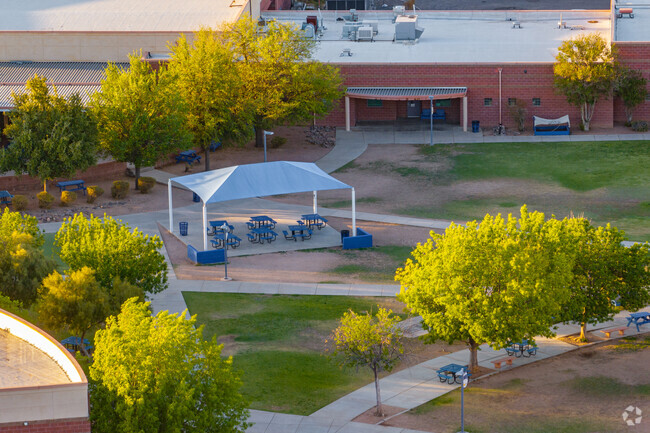 The school's courtyard and main entrance welcome students daily with shaded walkways and open space.