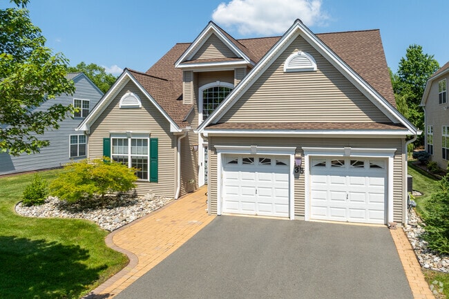 Modern ranch homes in Hamilton Marketplace offer single-level living with open floor plans, perfect for easy accessibility and comfortable lifestyles.