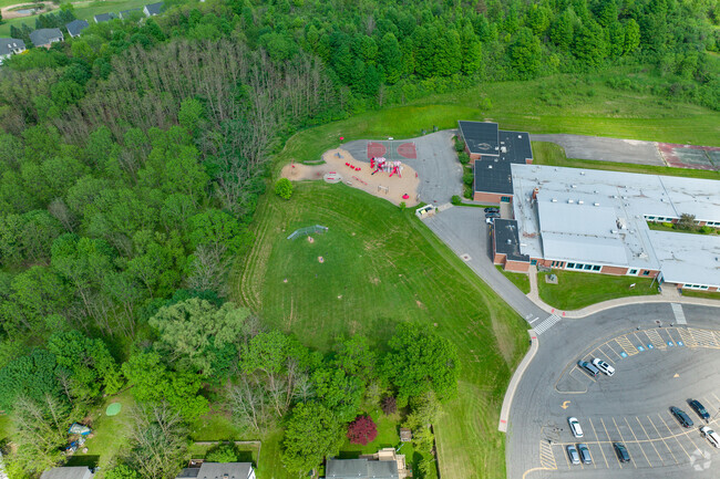 Tecumseh Elementary features a playground and sports field for students.