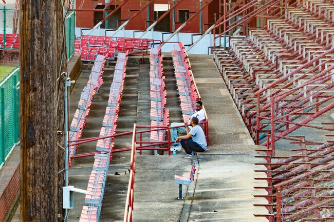 Martin Park residents catch a ball game at one of the ball fields at Bringhurst City Park.