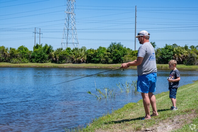 A father and son fish for largemouth bass in the lakes around Gibsonton.