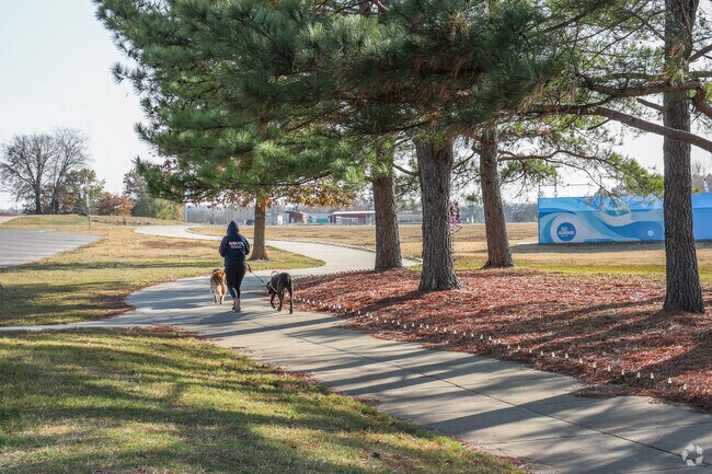Take the dogs for a walk on the paved trails of Claremore Lake Park.