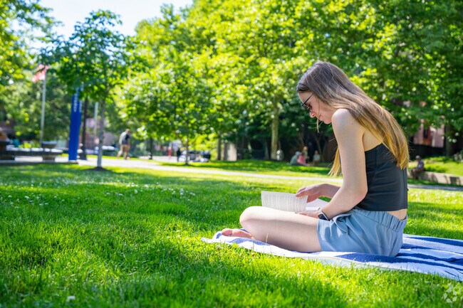 Sit and bask in the sunlight with your new book at Elliot Norton Park in Chinatown.