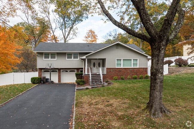 Houses in Parsippany-Troy Hills have large mature trees for locals to enjoy.