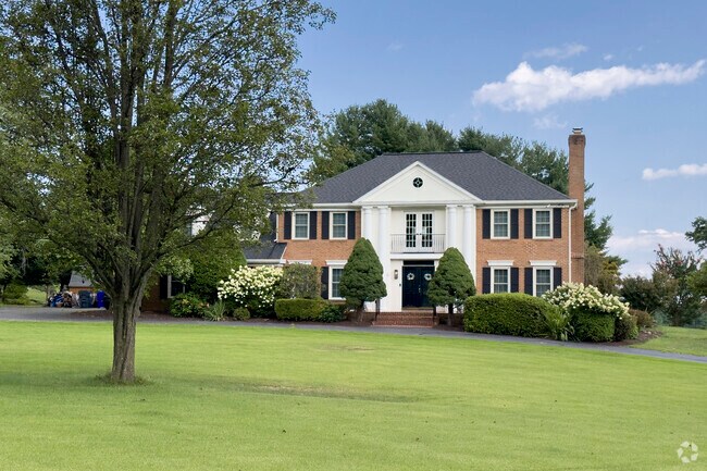 Brick Federal-style homes in Hickory Grove feature stately columns and classic architectural appeal.