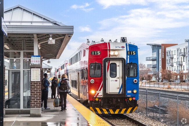 Passengers in Franklin get ready to board Trax.