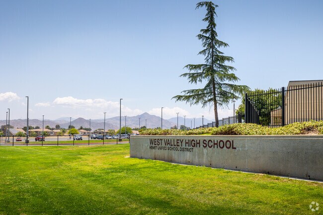 Green grass grows under the entrance sign at West Valley High School in Hemet.