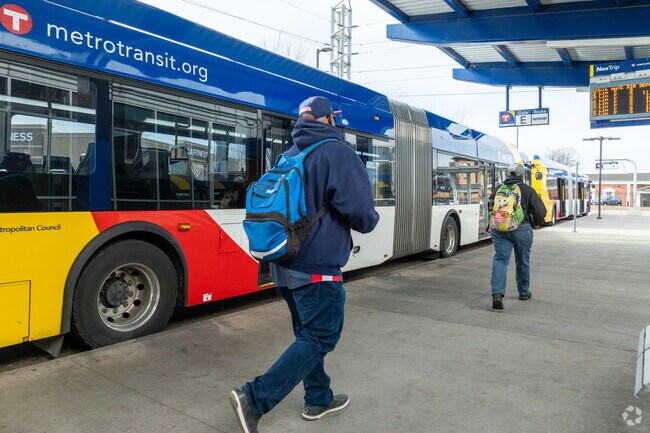 Riders embarking at the bustling Brooklyn Center Transit Center.