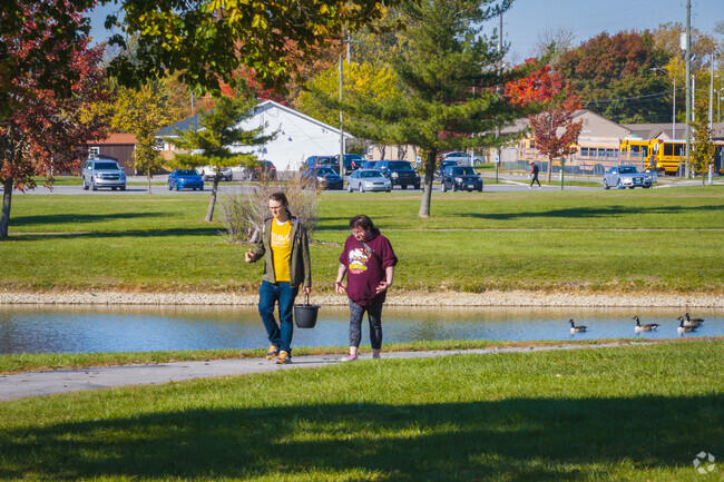 Good conversation with a friend is always welcome at Dr. Martin Luther King, Jr Center Park.