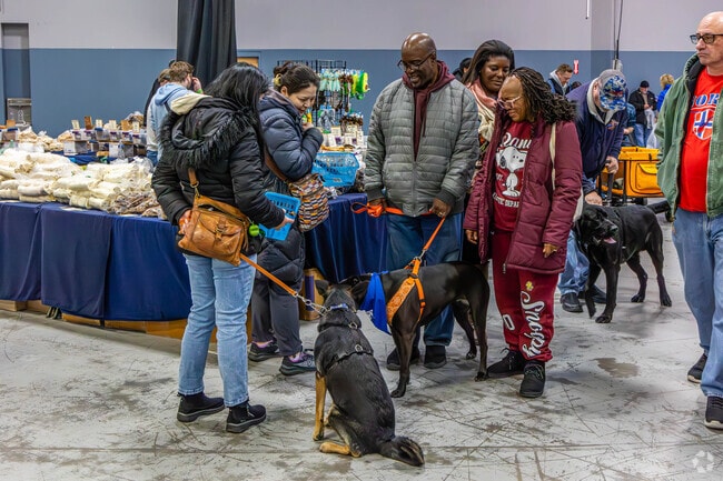 Pet owners gather to talk dogs at the Super Pet Expo in Edison, NJ.