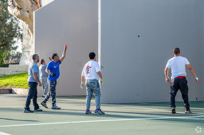 Star View residents play handball at Fountain Valley Sports Park’s outdoor courts.