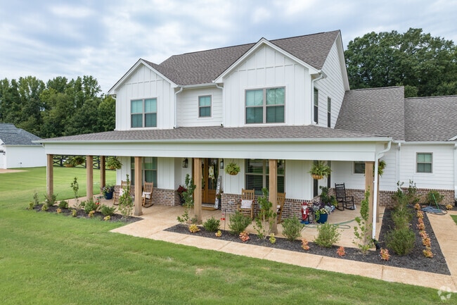 Some homes have wrap around porches that welcome their guests.