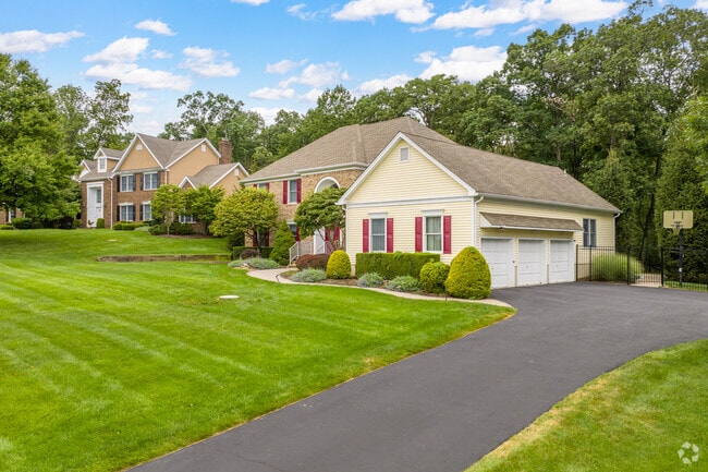 New traditional homes in Martinsville have driveways and garages for private parking.