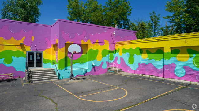 The Graham School has a colorful mural painted on its main building.