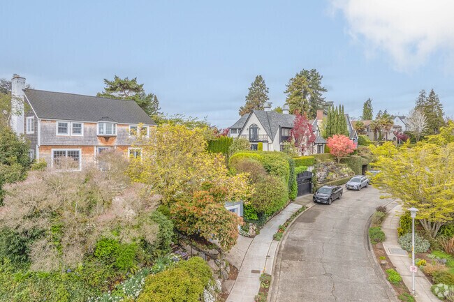 Single-family homes in Laurelhurst are often situated on hilled lots with rocky terraced yards.