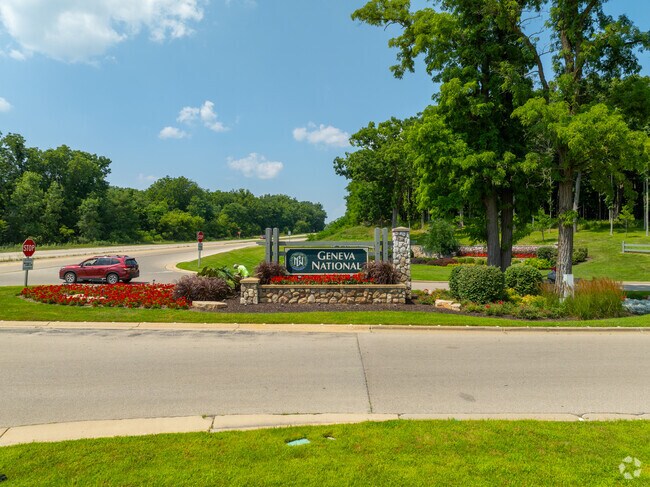 Stone monument sign marks the entrance to Geneva National resort and golf club.