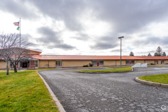 The Continuous Curriculum school is located near public parks in the area.