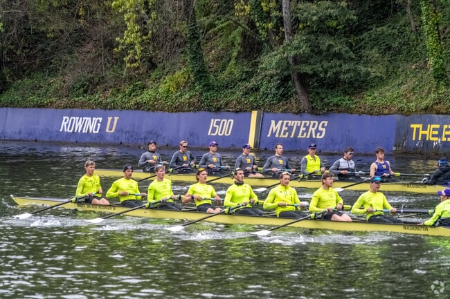 University Of Washington Varsity team paddling in Montlake Cut near Bryant.