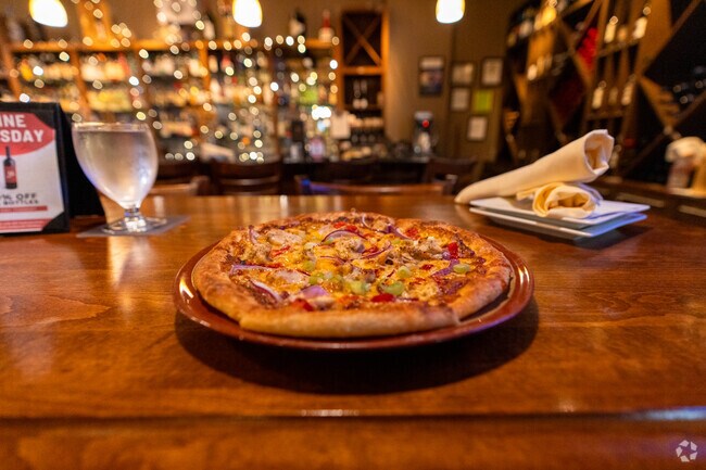 Enjoy happy hour pizza at Lombardi's Restaurant and Wine Bar in Canyon Creek-39th SE.