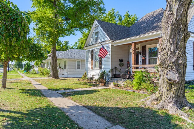 Narrow sidewalks connect homes to downtown shopping and dining.