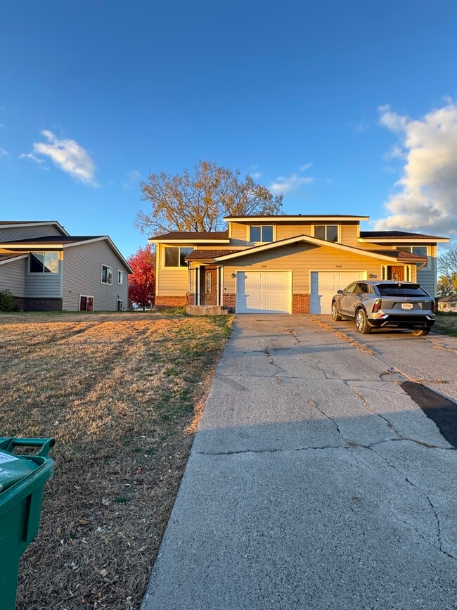 Outside currently with new garage doors