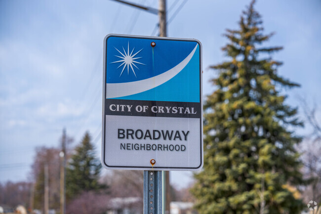 Signs welcome people into the Broadway neighborhood.