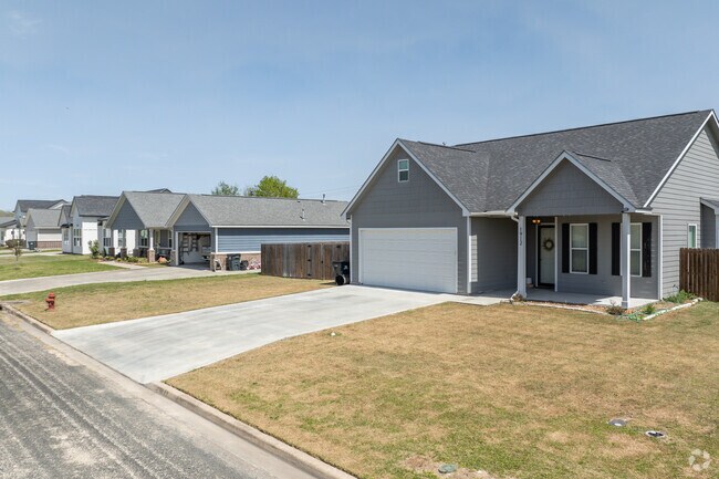A row of new construction homes sits on a cul-de-sac road in El Campo.