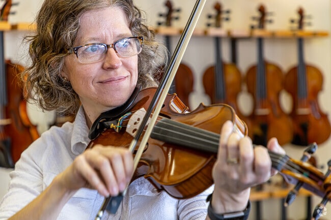 In Downtown Lafayette, Anya Burgess, Owner of Sola Violins, a violin maker, restorer and player.
