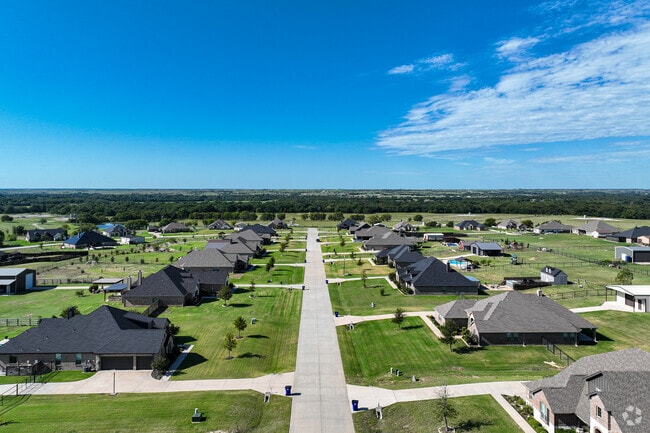 Some subdivisions in Ponder feature early-21st-century classic Texas-style brick ramblers.