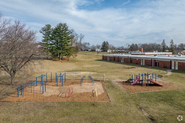 There is a playground for students to use by the side of the building.