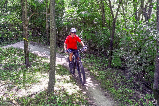 Fort Harrison State Park has bike trails running through diverse natural landscapes near Devon.