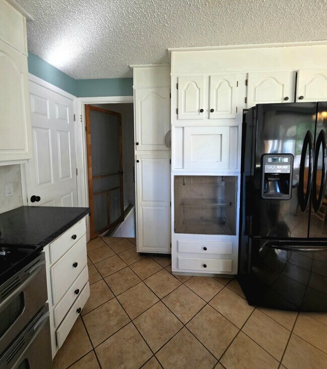 Kitchen into basement and garage