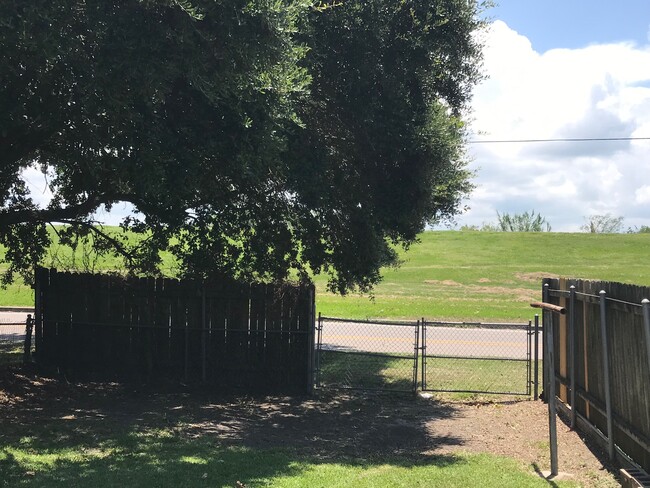 Large rear yard facing the levee
