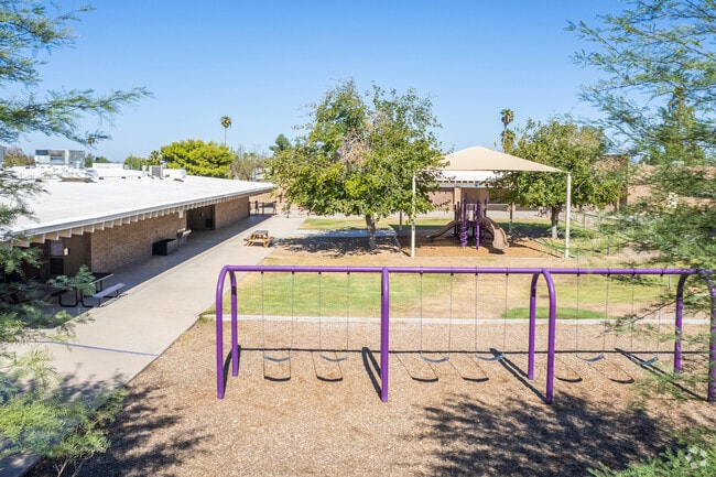 Children enjoy their time on the swings at Kachina Elementary School, Glendale.