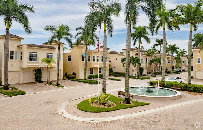 Adorable Villa style homes in the PGA Resort Community overlooking a fountain and courtyard.