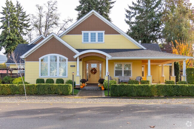 Colorful, large single-family homes line Coburg town Square.