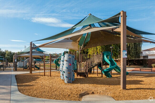 Kids flock to the playground at Bagdouma Park, located in nearby Coachella.