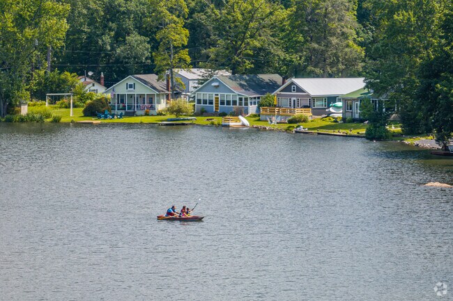 Families visit friends at Moon Lake in Barry and take boats out on the water for fishing or recreation.