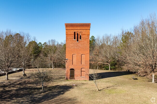 Portions of Whittier Mill Village's original mill still stand tall within the park.