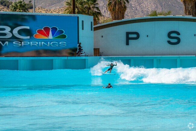 Surf enthusiasts ride artificial waves at the exciting Palm Springs Surf Club near Sonora Sunrise.