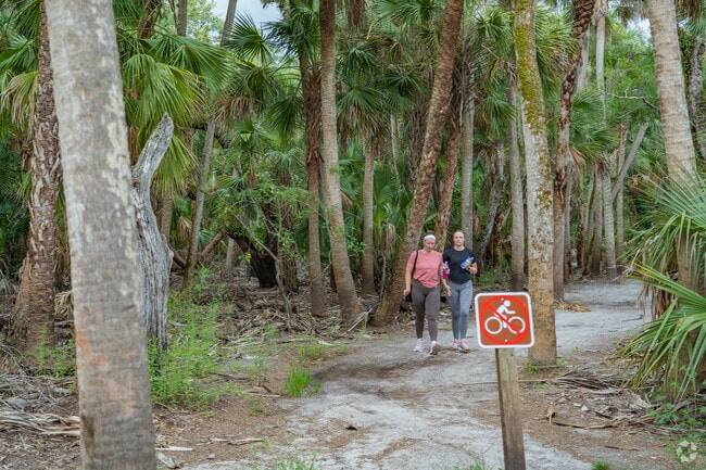 Walking paths wind through Florida trees near Myakka Valley Ranches.