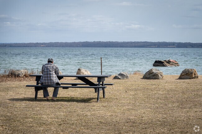 Enjoy peaceful moments by the bay at the picnic table at North Kingstown Town Beach in Cold Spring Beach, RI.