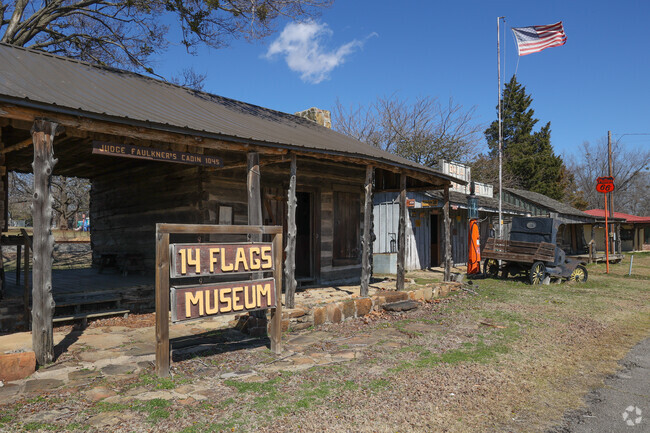 Learn about important figures and milestones in the history of Sallisaw at 14 Flags Museum.